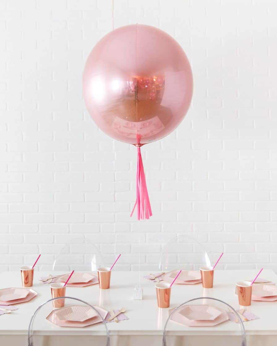 Life In Plastic 21in Rose Gold Orb Foil Balloon with Fuchsia Skirt Centerpiece | Rental