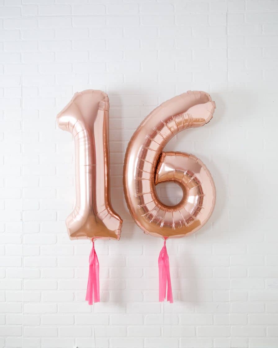 Life In Plastic – 34in Rose Gold Foil Numbers with Fuchsia Skirts | Rental